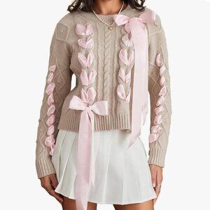 Elegant Beige Sweater with Pink Ribbon Accents